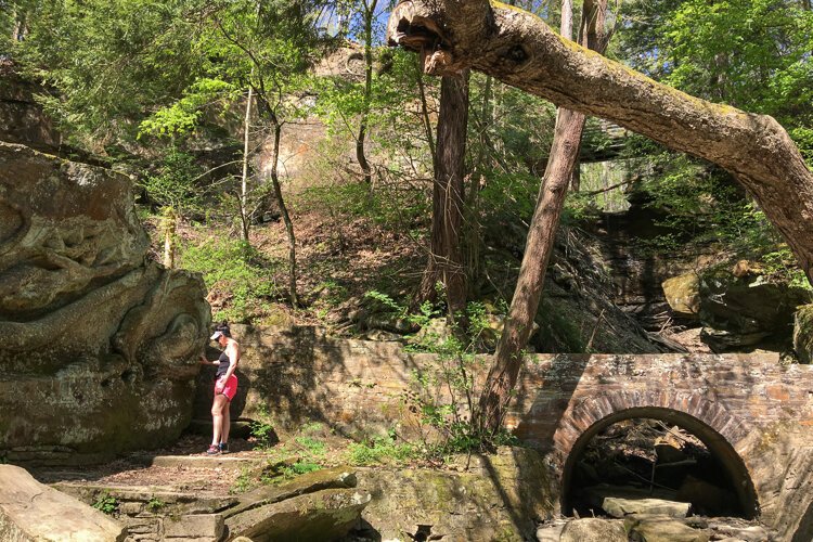 Kim Chapman gets a closer inspection of the enormous Henry Church Rock.